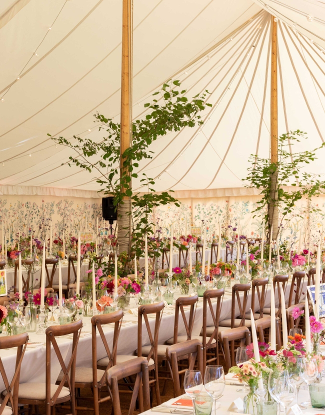 Vibrant pink and green wedding decor for Sophie Coleridge and Lucien Ireland's wedding. Long wedding reception tables with pink and green flowers, custom stationery and decor from Noble Decor Hire.